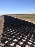 Photo No.1 Placing of geogrid and geotextile at section SP 926+00-SP927+00 on left side of the road 
