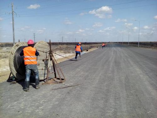 Traffic interchange. Cable illumination installation left side of road Akkyr-Zhalagash Traffic interchange. Cable illumination installation left side of road Akkyr-Zhalagash