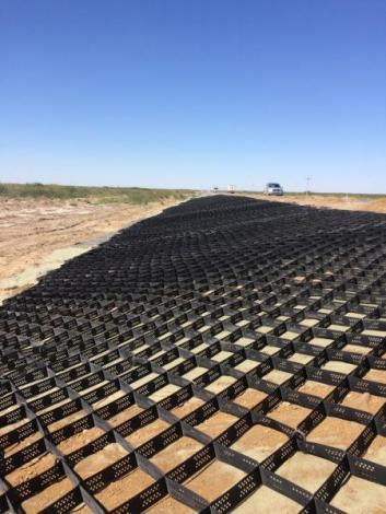 Photo No.2 Placing of geogrid and geotextile at section SP 925+00-SP926+20 on right side of the road Photo No.2 Placing of geogrid and geotextile at section SP 925+00-SP926+20 on right side of the road