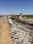 Photo No.6 Filling of crushed stone to fill the geogrid at slopes in impounded sections SP 840+80-SP 857+00 from the left side 