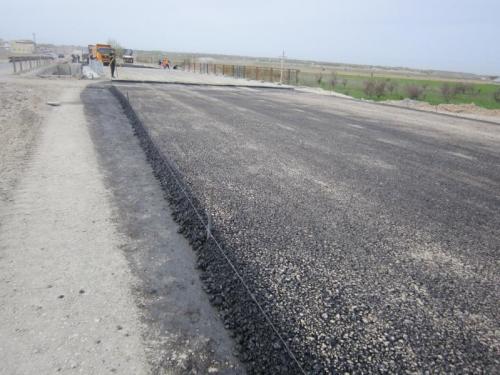 Км 662+094-662+187 R . Устройство нижнего слоя покрытия из крупнозернистого пористого асфальтобетона на подходах к мосту №8 Км 662+094-662+187 R . Устройство нижнего слоя покрытия из крупнозернистого пористого асфальтобетона на подходах к мосту №8