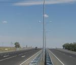 Installatioon of lighting poles and guardrails on overpass 