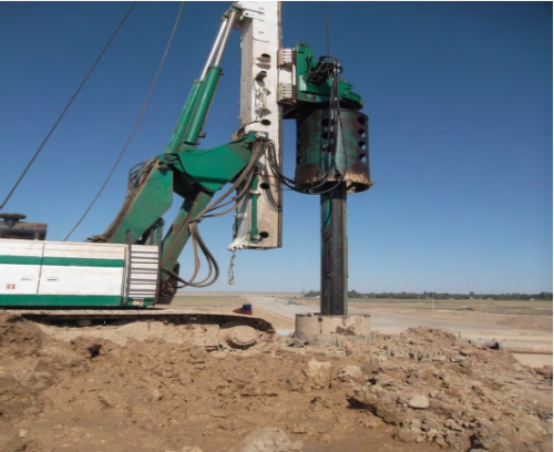 Well drilling under driven pile on interchange Well drilling under driven pile on interchange